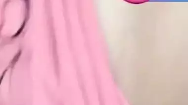 Pretty Desi woman lifts pink top to show boobs during the porn video call