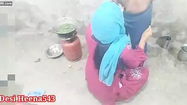 The brother-in-law, who is cooking food in the kitchen