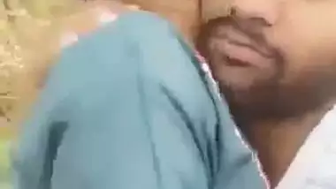 Indian outdoor sex of a guy sucking his GF’s tight boobs