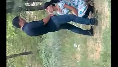 records a young couple enjoying oral sex behind their house