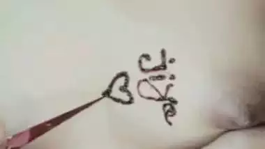 Nude girl puts henna on her naked body during a video call sex