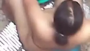 Spy XXX video of village aunty taking bath in outdoor taken by her lewd neighbor