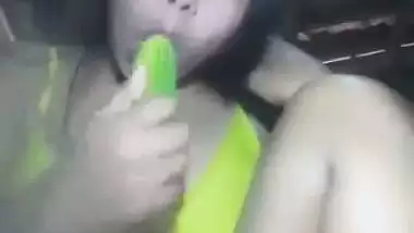 Naked Assamese girl fucks her pussy with a cucumber